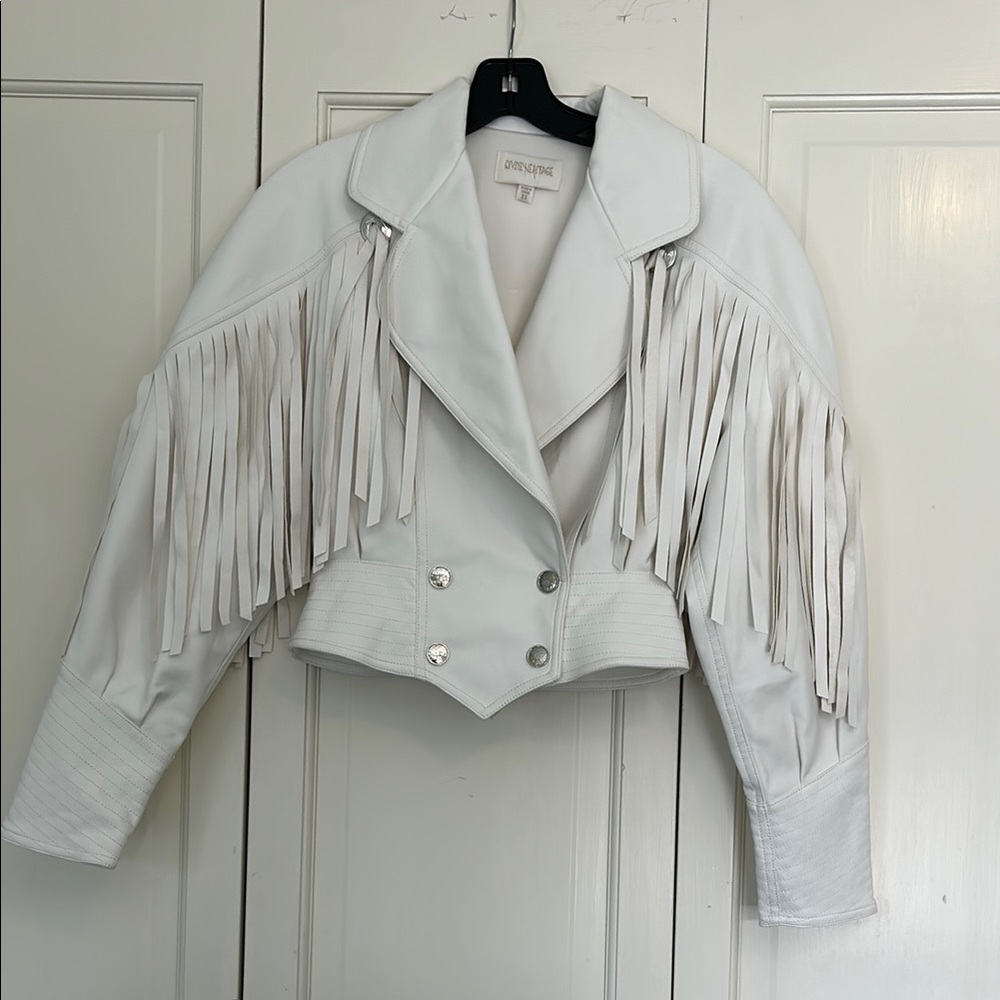 Divine Heritage vegan white leather jacket with fringe.